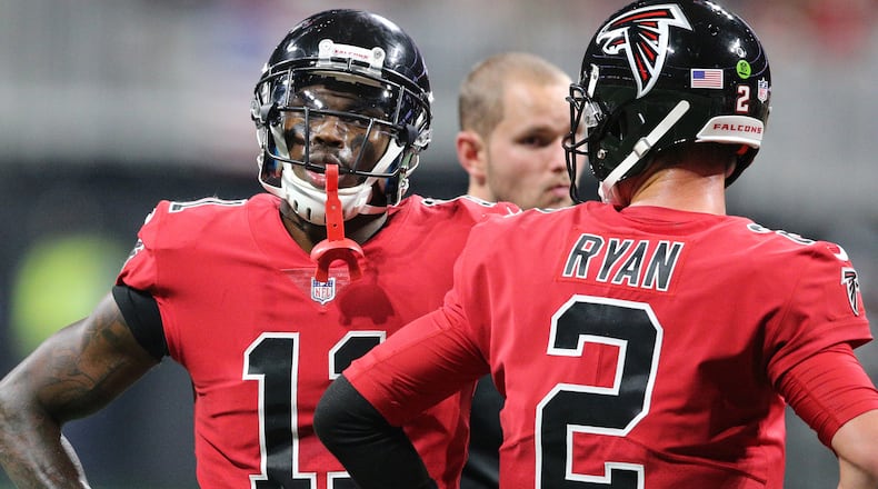 Atlanta Falcons wide receiver Julio Jones and quarterback Matt Ryan confer during the second half against the Saints Thursday, Dec. 7, 2017, in Atlanta.