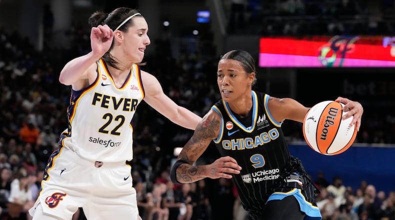 Chicago Sky guard Natasha Cloud, right, drives against Indiana Fever guard Caitlin Clark during the second half of a WNBA basketball game Sunday, Aug. 23, 2026, in Chicago. (AP Photo/Nam Y. Huh)