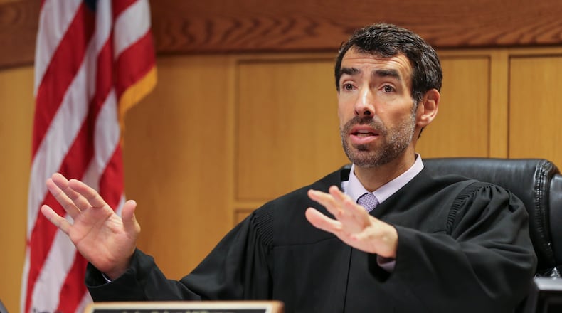 Fulton County Superior Court Judge Robert McBurney is one of very few judges in Georgia who allows jurors to ask questions to witnesses at trial. Here is McBurney during a court hearing in June. (JOHN SPINK/JSPINK@AJC.COM)
