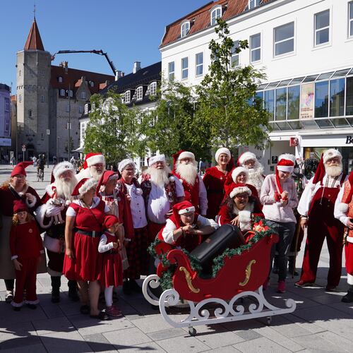 Santas, Mrs. Clauses and Christmas elves from around the world pose for a photo at the annual World Santa Claus Congress, a colorful midsummer tradition, in Aalborg, Denmark, Wednesday July 8, 2026. (AP Photo/James Brooks)