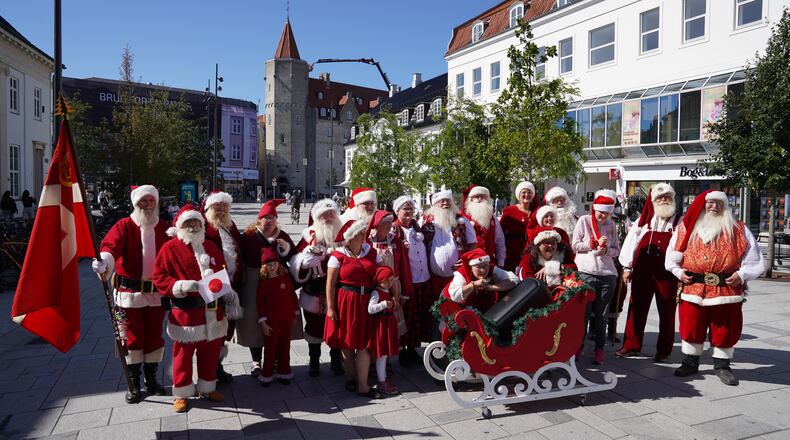Santas, Mrs. Clauses and Christmas elves from around the world pose for a photo at the annual World Santa Claus Congress, a colorful midsummer tradition, in Aalborg, Denmark, Wednesday July 8, 2026. (AP Photo/James Brooks)
