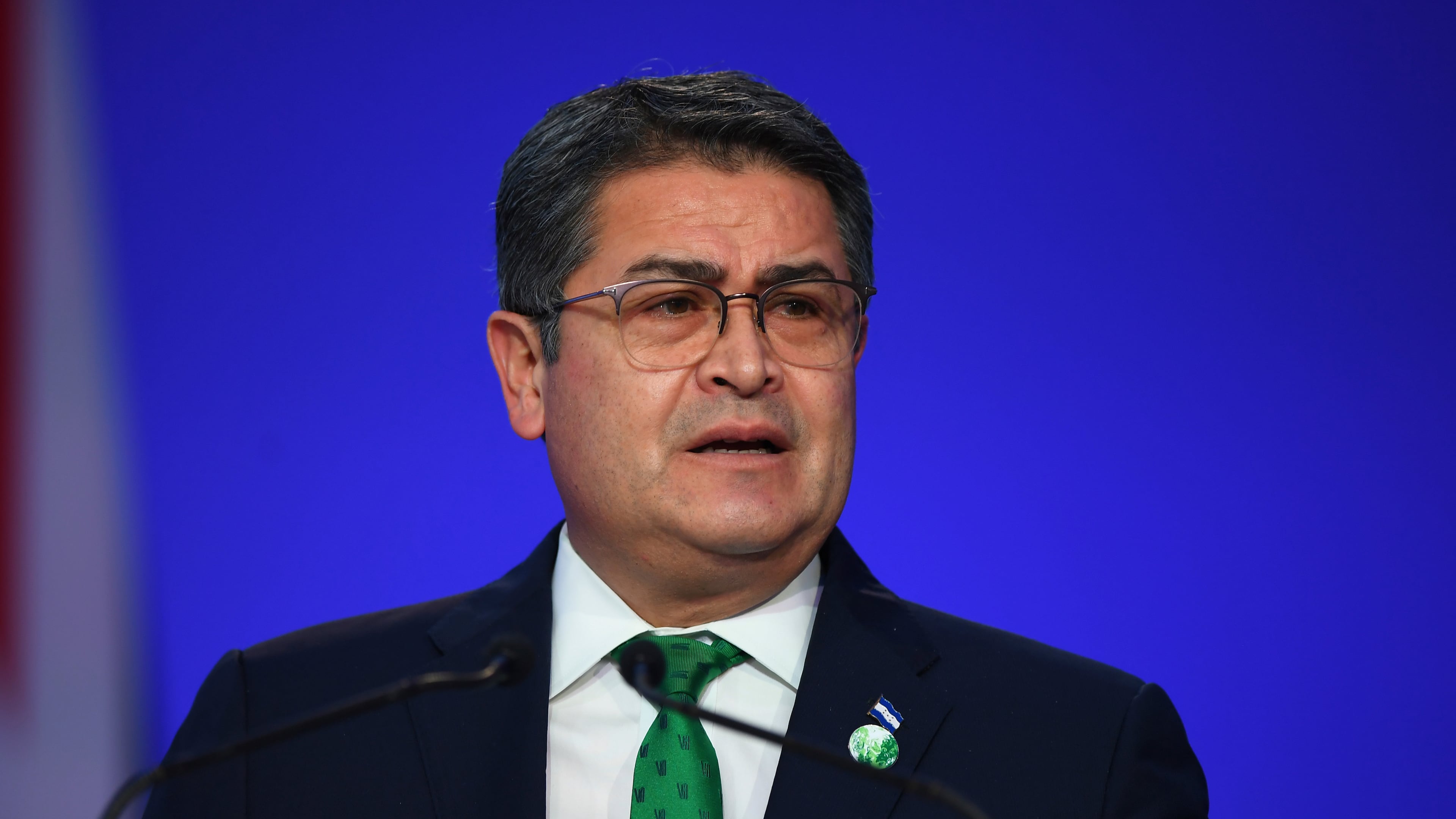 FILE - Honduras' President Juan Orlando Hernandez speaks during the opening ceremony of the UN Climate Change Conference COP26 in Glasgow, Scotland, Monday Nov. 1, 2021. Andy Buchanan/Pool via AP, File)
