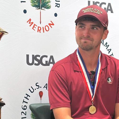 Jack Whaley admires his US Amateur golf championship trophy Sunday, Aug. 16, 2026, at Merion Golf Club in Ardmore, Pa. (AP Photo/Dan Gelston)