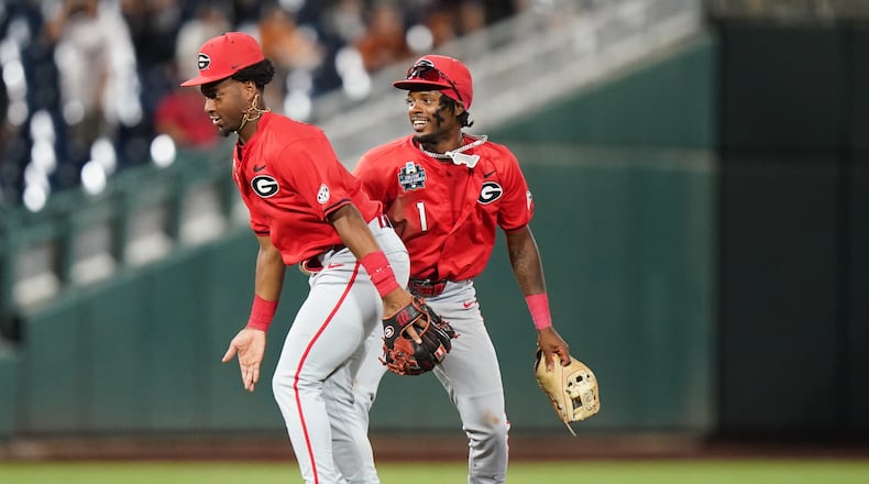Georgia teammates celebrate after an NCAA baseball College World Series elimination game against Texas, Tuesday, June 16, 2026 in Omaha, Neb. Georgia won 2-0. (AP Photo/Vera Nieuwenhuis)