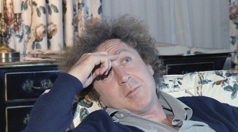 FILE - In a Dec. 9, 1977 file photo, actor Gene Wilder is shown during an interview with Jean Claude Bouis at his New York City Hotel. Wilder’s nephew said Monday, Aug. 29, 2016, that the actor and writer died late Sunday at his home in Stamford, Connecticut, from complications from Alzheimer’s disease. He was 83. (AP Photo/Richard Drew, File)