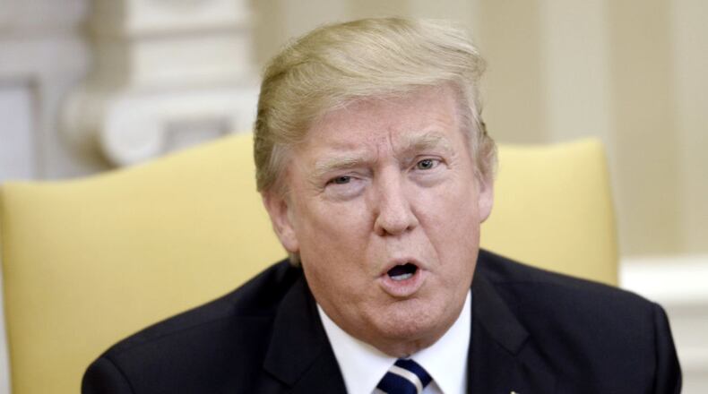 President Donald Trump will not be paying out of pocket for trips to his Mar-a-Lago compound in Palm Beach Florida, his spokesman Sean Spicer said at an April 3 press briefing. (Photo by Olivier Douliery-Pool/Getty Images)