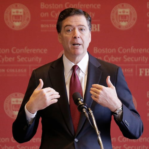 FILE - FBI Director James Comey gestures as he speaks on cyber security at the first Boston Conference of Cyber Security at Boston College, March 8, 2017, in Boston. (AP Photo/Stephan Savoia, File)