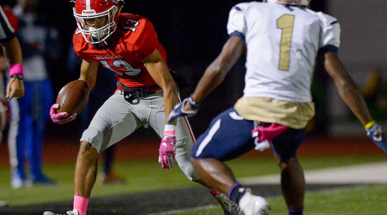 Allatoona junior WR Asante Das (13) runs out of room as Hapeville Charter senior CB Malik Fleming (1) forces him to the sidelines in the first half of a 2018 game. PHOTO/Daniel Varnado