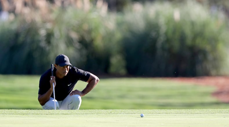 Tiger Woods prepares to putt on the 3rd green during the second round of the Masters Friday, Nov. 13, 2020 at Augusta National Golf Club in Augusta, Georgia. (Curtis Compton/Atlanta Journal-Constitution/TNS)