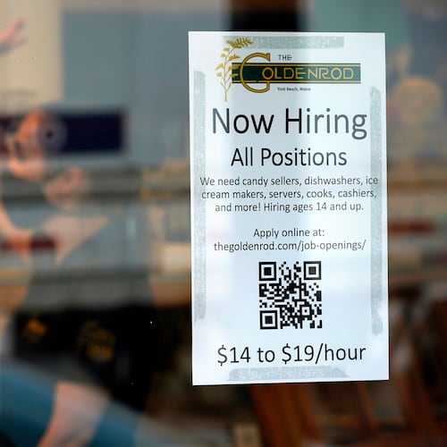 FILE - A sign advertises for help The Goldenrod, a popular restaurant and candy shop, Wednesday, June 1, 2022, in York Beach, Maine. (AP Photo/Robert F. Bukaty, File)