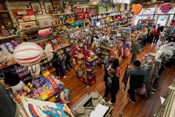 Shoppers visit Economy Candy in New York's Lower East Side, Friday, April 4, 2025. (AP Photo/Richard Drew)