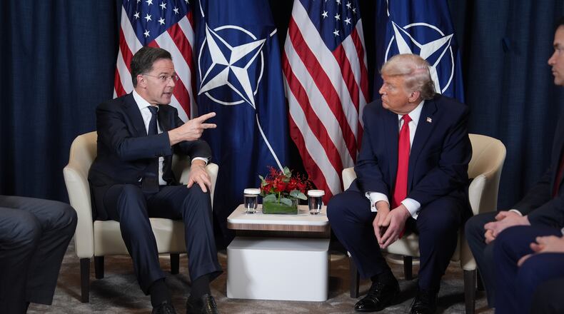 President Donald Trump, right, meets with NATO Secretary General Mark Rutte during a meeting on the sidelines of the Annual Meeting of the World Economic Forum in Davos, Switzerland, Wednesday, Jan. 21, 2026. (AP Photo/Evan Vucci)
