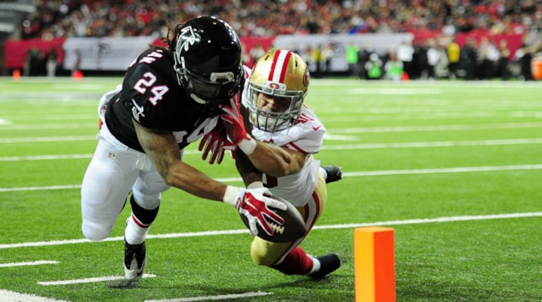 A Devonta Freeman #24 of the Atlanta Falcons fails to reach the pylon against Vinnie Sunseri #40 of the San Francisco 49ers during the first half at the Georgia Dome on December 18, 2016 in Atlanta, Georgia. (Photo by Scott Cunningham/Getty Images)