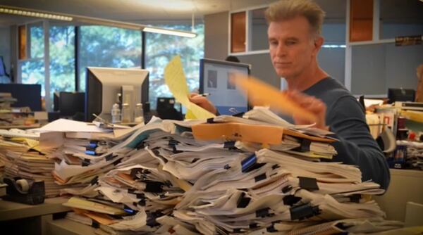 A reporter always has lots to read. AJC columnist Bill Torpy mulls the next tidbit. (AJC file photo)