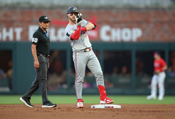Minnesota Twins catcher Ryan Jeffers (27) celebrates after driving in a run in the second inning of a baseball game against the Atlanta Braves, Friday, April 18, 2025, in Atlanta. (AP Photo/Colin Hubbard)