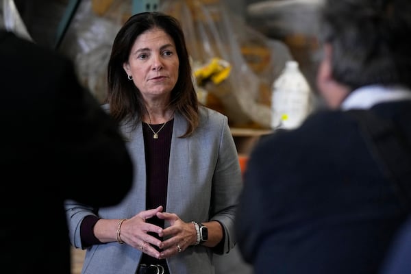 FILE-Kelly Ayotte speaks with Manchester, N.H. businessmen in this Oct. 16, 2024 file photo. (AP Photo/Charles Krupa)
