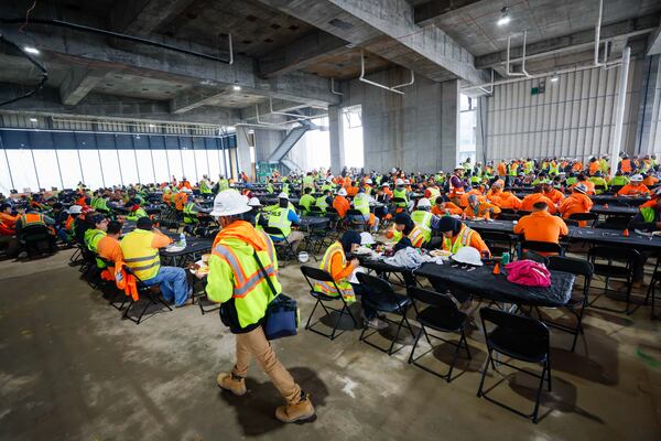 Construction workers celebrated with lunch on Wednesday to mark a milestone in the construction of the Phoenix Hotel, which has now reached its highest point. The boutique hotel is one of six buildings under construction at Centennial Yards in Downtown Atlanta. Miguel Martinez/AJC