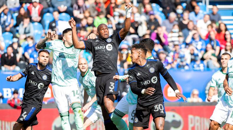 CF Montreal's Kamal Miller (3) goes up for the ball and scores against Atlanta United during the first half of an MLS soccer game last Saturday in Montreal. (Graham Hughes/The Canadian Press via AP)