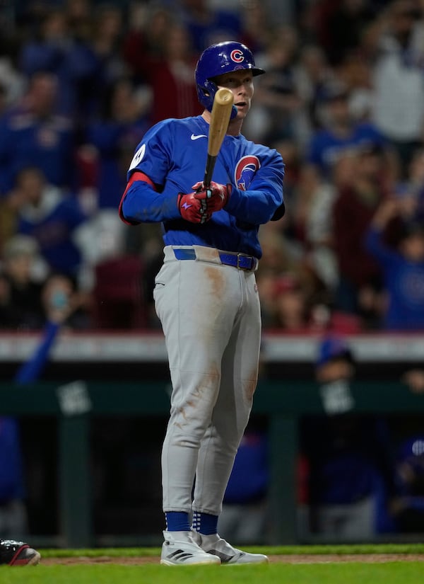 Chicago Cubs' Pete Crow-Armstrong watches hit grand slam to right field during the seventh inning of a baseball game against the Cincinnati Reds, Friday, May 23, 2025, in Cincinnati. (AP Photo/Carolyn Kaster)