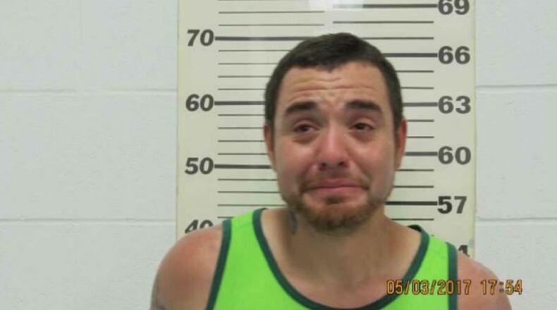 Alexander Jennes Downing  was arrested  charged with public intoxication May 3 after threatening a Muslim family. The incident was caught on video.