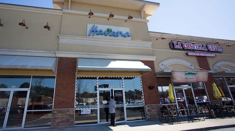Customers make their way into Havana, a Brookhaven restaurant, for a classic Cuban sandwich for lunch.