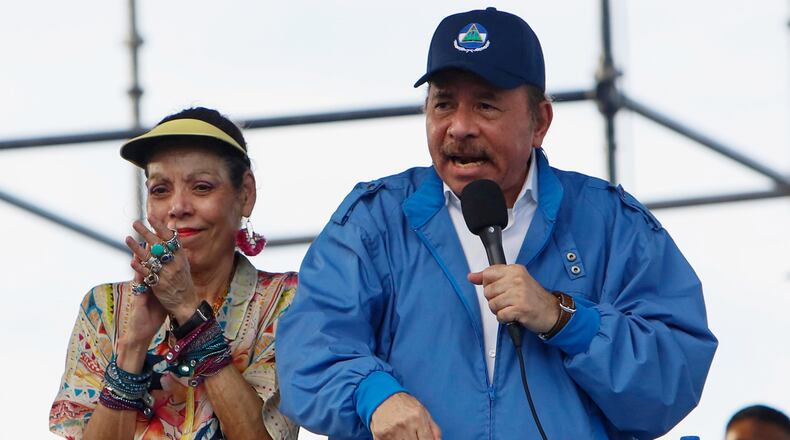 FILE - Nicaragua's President Daniel Ortega speaks to supporters as his wife and Vice President Rosario Murillo applauds, in Managua, Nicaragua, Aug. 29, 2018. (AP Photo/Alfredo Zuniga, File)