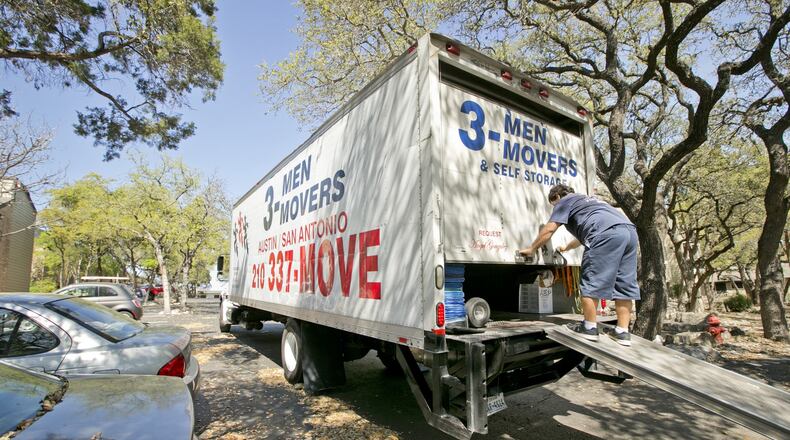 Omar Arroyo of 3-Men Movers closes his truck after moving in a new resident from Round Rock into Westdale Creek Apartments in Austin in March. Though the Texas House and Senate’s spending plans disagree on the final amount, “more important is the fact that both chambers have constructed budgets that at least on paper keep spending increases to less than population growth plus inflation,” write Bill Peacock and Vance Ginn of the Texas Public Policy Foundation.