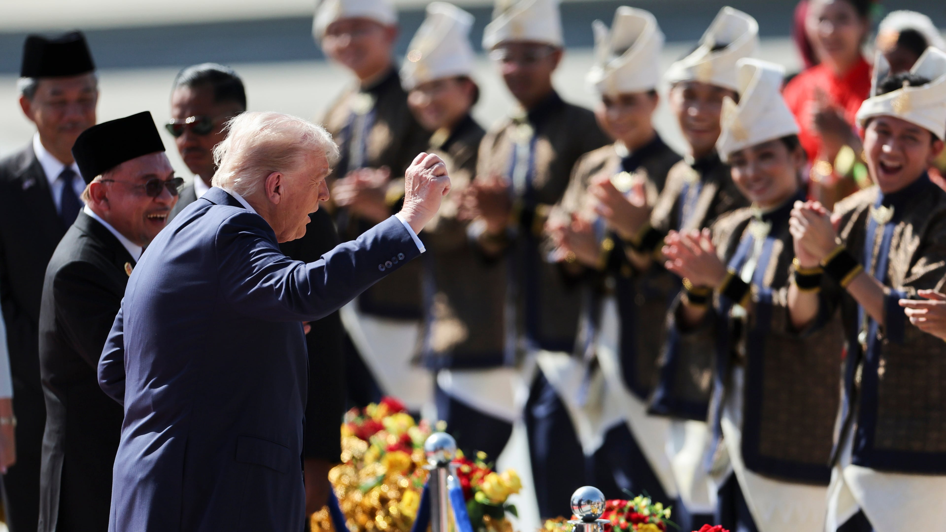 U.S. President Donald Trump reacts to dancing performers during a welcoming ceremony after arriving at Kuala Lumpur International Airport, to attend the 47th Association of Southeast Asian Nations (ASEAN) summit in Kuala Lumpur, Malaysia, Sunday, Oct. 26, 2025. (Hasnoor Hussain/Pool Photo via AP)