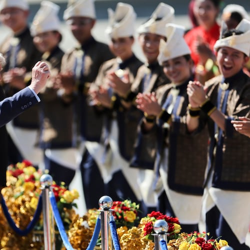 U.S. President Donald Trump reacts to dancing performers during a welcoming ceremony after arriving at Kuala Lumpur International Airport, to attend the 47th Association of Southeast Asian Nations (ASEAN) summit in Kuala Lumpur, Malaysia, Sunday, Oct. 26, 2025. (Hasnoor Hussain/Pool Photo via AP)