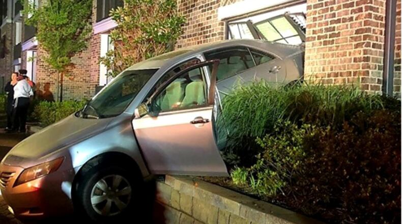 A 13-year-old accidentally backed her mother's car into a Duluth apartment, police said.