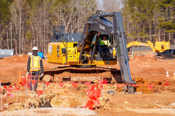 Construction workers use an excavator to move dirt at the home of the United States Soccer Federation on Tuesday, Jan. 14, 2024, in Atlanta, at U.S. Soccer Federation Headquarters in Fayetteville, Georgia. (Jason Allen/AJC)