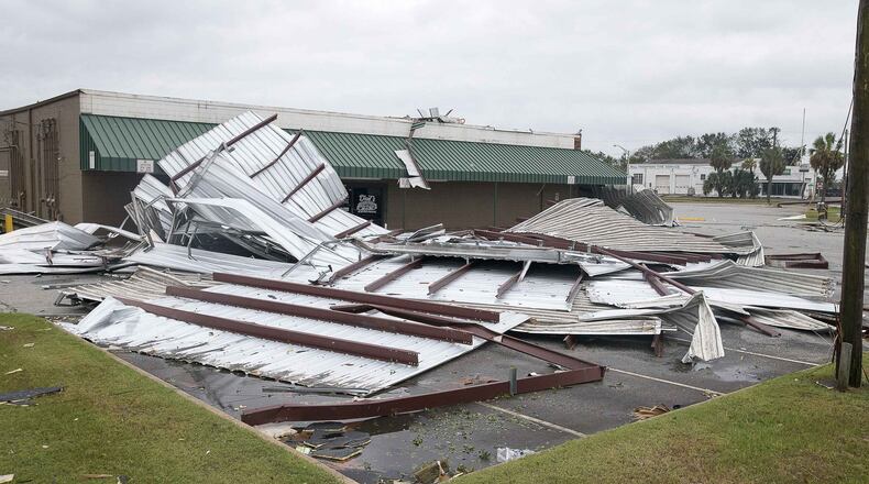 Large sheets of metal debris rests in the parking lot of the Shackleford shopping center following Hurricane Michael in Albany, Thursday, October 11, 2018. Hurricane Michael passed through Albany as a Category 2 hurricane. (ALYSSA POINTER/ALYSSA.POINTER@AJC.COM)