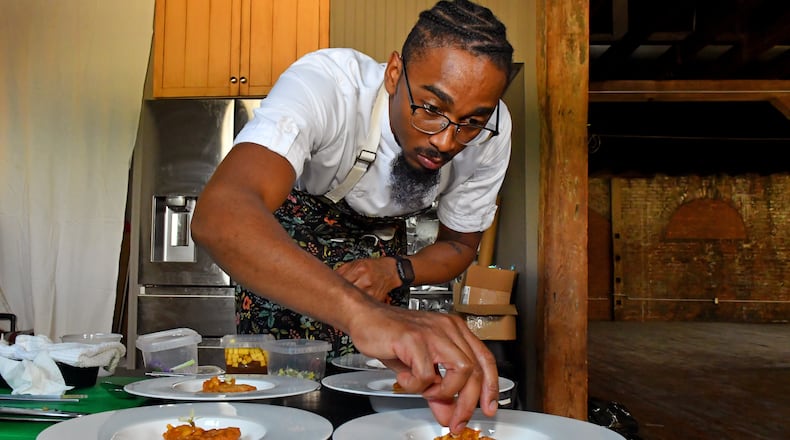 Chef Demetrius Brown prepared fried flatbread topped with marmalade as the sixth course of A Dinner at 29, an eight-course meal for the Heritage Supper Club designed to honor his Trinidadian great-grandmother, Elizabeth Castle. (CHRIS HUNT FOR THE ATLANTA JOURNAL-CONSTITUTION)