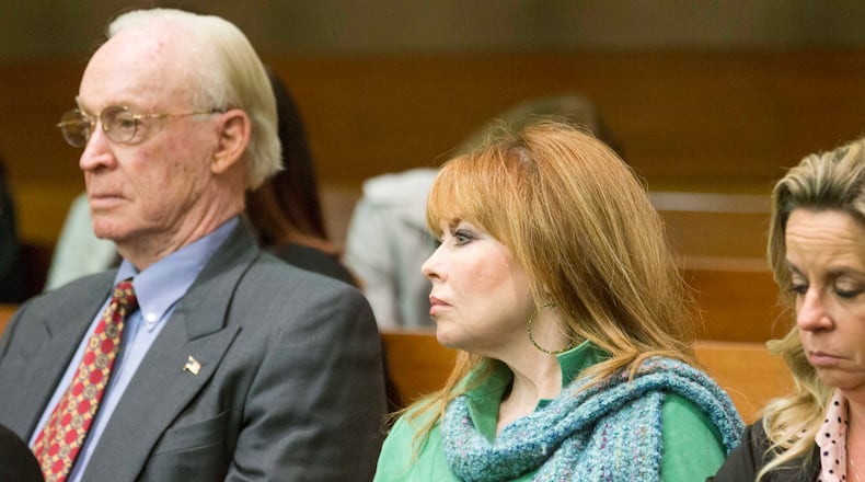 03/10/2018 -- Atlanta, GA - William "Billy" E. Corey, owner of U.S. Enterprises, left, and Dani Jo Carter, center, sit in the audience. End-of-day arguments in the Tex McIver murder trial focused on charges McIver attempted to influence witnesses, including Carter. ALYSSA POINTER/ALYSSA.POINTER@AJC.COM