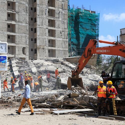 A rescue team works at the scene of a collapsed building in Nairobi, Kenya, Friday, Jan. 2, 2026. (AP Photo/Andrew Kasuku)