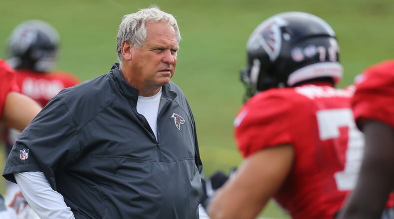 Falcons defensive coordinator Richard Smith watches over the defensive unit during team practice on Tuesday, August, 18, 2015, in Flowery Branch.