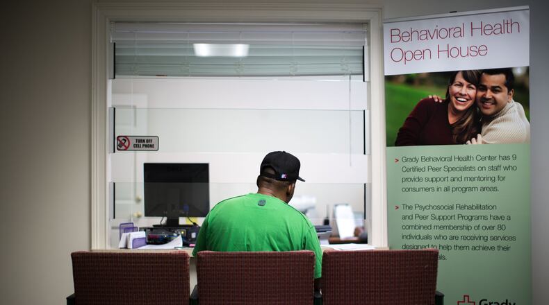 A patient waits to talk with a clinician at Grady Memorial Hospital’s outpatient mental health clinic in 2020. Branden Camp / For the AJC