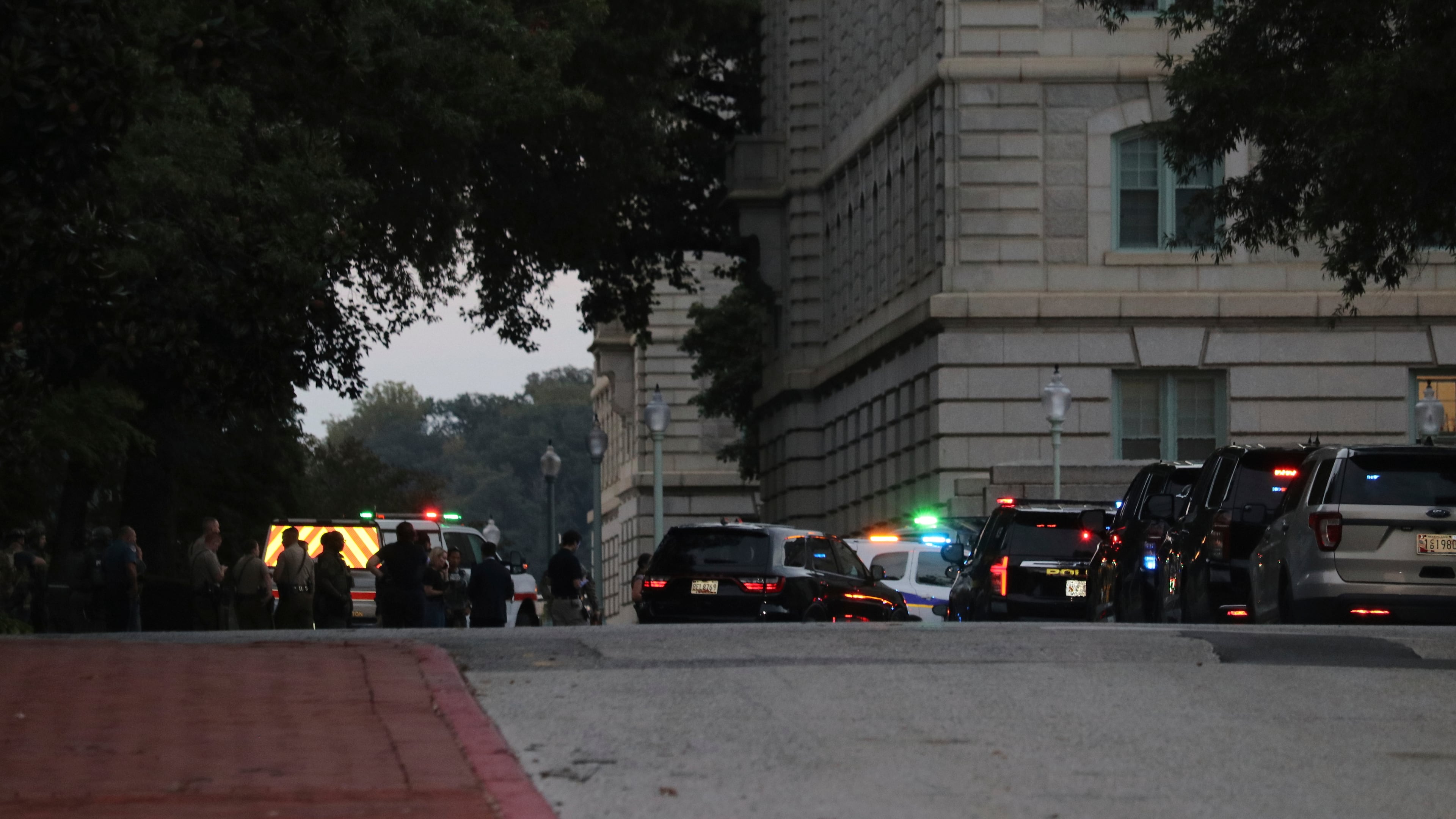 Law enforcement officers gather on the grounds of the U.S. Naval Academy in Annapolis, Md., Thursday, Sept. 11, 2025. (AP Photo/Brian Witte)