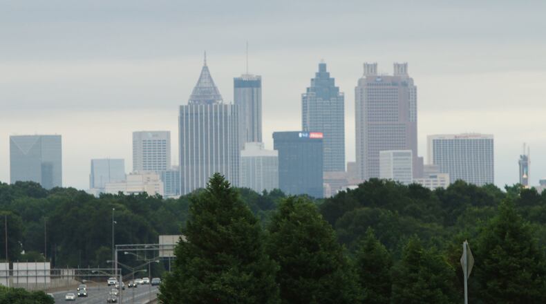 Trees sit below the Atlanta skyline as cars drive by on June 12, 2019. (credit: Christina Matacotta)