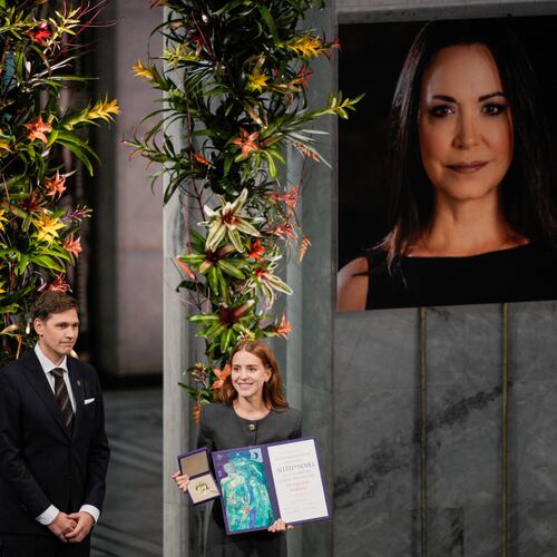 The daughter of the Nobel Peace Prize laureate, Ana Corina Sosa, accepts the award on behalf of her mother, Venezuelan opposition leader Maria Corina Machado, during the Nobel Peace Prize ceremony at Oslo City Hall, Norway, Wednesday Dec. 10, 2025. (Stian Lysberg Solum/NTB Scanpix via AP)