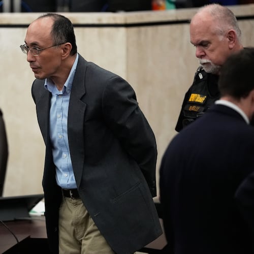 Chikei Rick Chow, left, accused in the 2023 fatal shooting of a Black 14-year-old, is escorted in the courtroom during his murder trial, Friday, May 29, 2026, in Columbia, S.C. (AP Photo/Erik Verduzco)