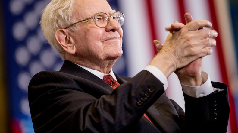 Warren Buffett’s firm, Berkshire Hathaway Inc., now owns substantial stakes in both Coke and Delta. (AP Photo/Andrew Harnik)