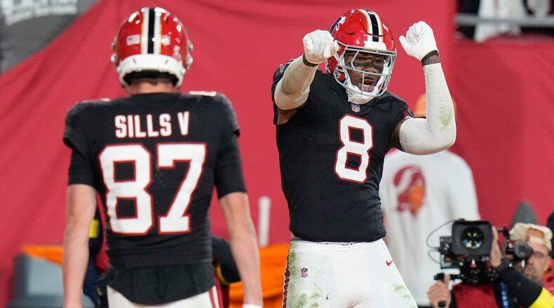 Atlanta Falcons tight end Kyle Pitts Sr. (8) celebrates his touchdown against the Tampa Bay Buccaneers during the first half of an NFL football game, Thursday, Dec. 11, 2025, in Tampa, Fla. (AP Photo/Chris O'Meara)