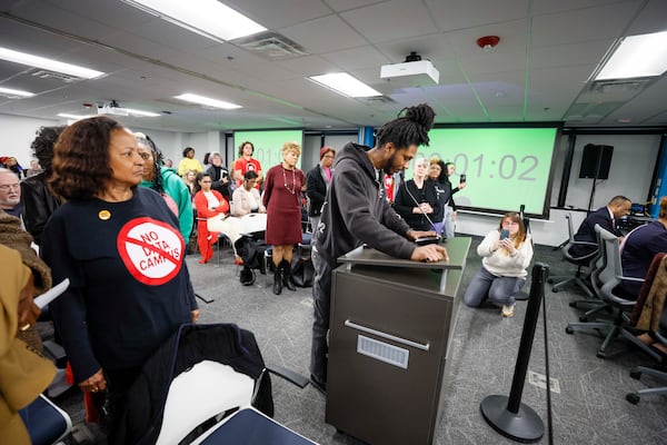 Rafi Powell is shown during public comments at the DeKalb Board of Commissioners meeting in Decatur on Tuesday, Dec. 16, 2025, opposing the construction of data centers. (Miguel Martinez/AJC)