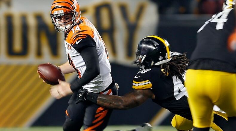 Cincinnati Bengals quarterback Andy Dalton (14) is sacked by Pittsburgh Steelers outside linebacker Bud Dupree (48) during the second half of an NFL football game in Pittsburgh, Sunday, Oct. 22, 2017. (AP Photo/Keith Srakocic)