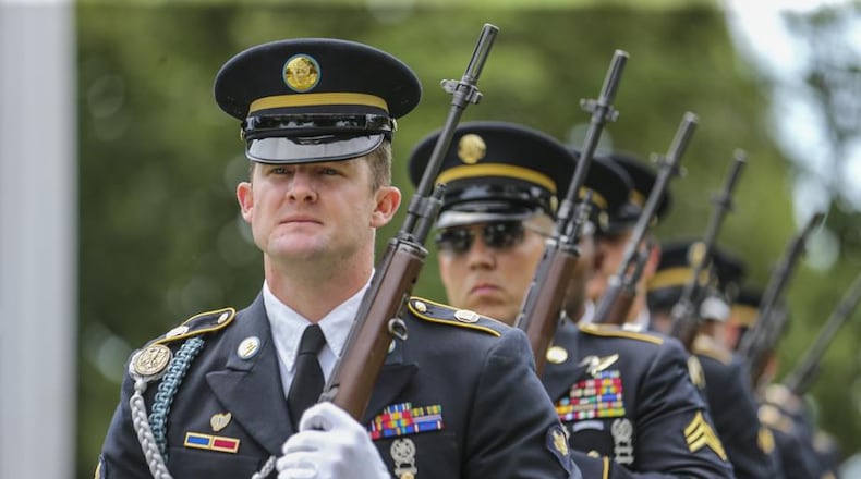 Georgia Army National Guard Honor Guard Specialist Ronnie Reddish stands at attention during the Memorial Day ceremony at the Marietta National Cemetery on Monday, May 29, 2017. JOHN SPINK/JSPINK@AJC.COM.