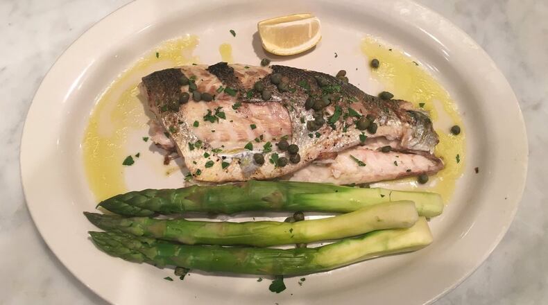 Grilled branzino is one of the seafood delicacies on the menu at Cibo e Beve’s Christmas Eve Feast of the Seven Fishes. CONTRIBUTED BY CIBO E BEVE