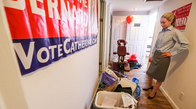 Georgia House of Representatives District 80 candidate Catherine Bernard surveys the damage at her campaign headquarters on Mon day. John Spink, jspink@ajc.com