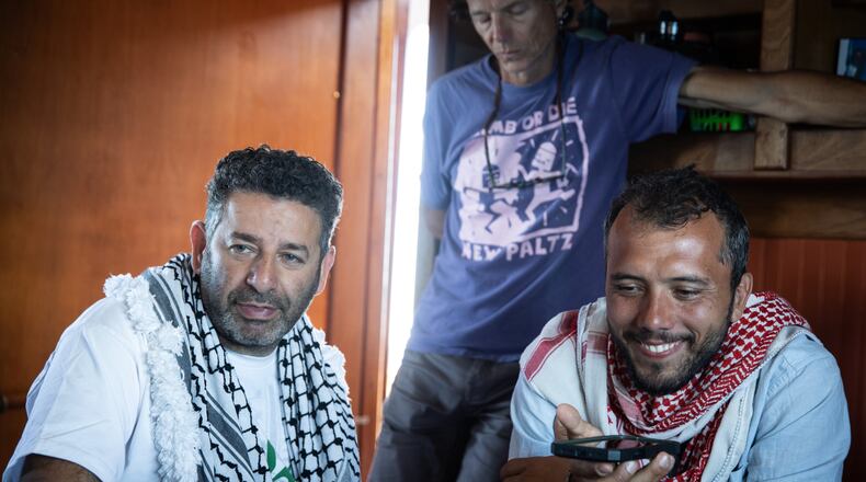 Saif Abukeshek, a Palestinian-Spanish activist and member of the Global Sumud Flotilla’s steering committee, left, and Thiago Ávila, a Brazilian activist and member of the Global Sumud Flotilla’s steering committee, aboard the Greenpeace vessel Arctic Sunrise, which joined a Gaza-bound flotilla in the Mediterranean Sea on April 18, 2026. (Max Cavallari/Greenpeace via AP)