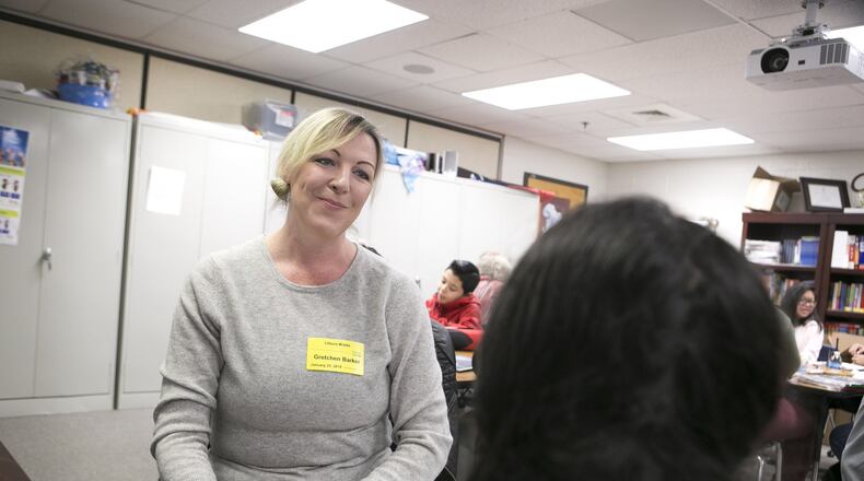 01-25-19 - Lilburn, GA - Mentor Gretchen Barker talks with sixth-grader Ruby Garcia during a weekly mentoring session at Lilburn Middle School in Lilburn, Ga., on Friday, Jan. 25, 2019. (Casey Sykes for The Atlanta Journal-Constitution)